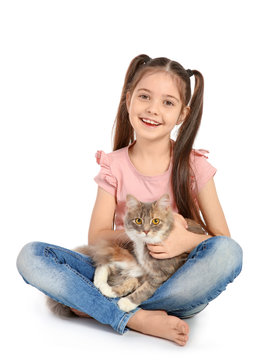 Cute little girl with cat on white background