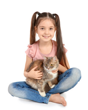 Cute little girl with cat on white background