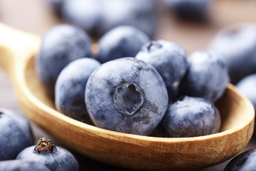 ripe organic bog whortleberryin a spoonful
