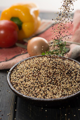 Mix of organic white, yellow and black quinoa, dietary and healthy food