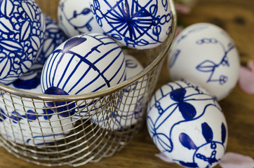 handmade designs drawn easter eggs in the bowl