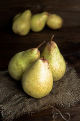 pears on canvas and wooden board