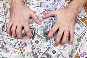 Men's hands and dollars