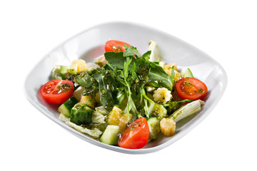 Greek salad. Vegetable with arugula leaves, green salad, with cherry tomatoes, fetta cheese, red onion, and mixed greens