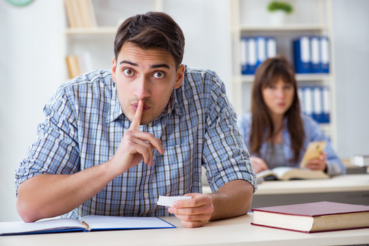 Students sitting and studying in classroom college