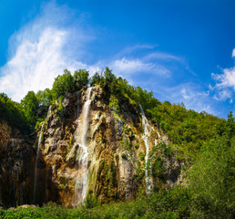 Tall waterfall in The Plitvice Lakes National Park	