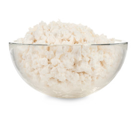 Bowl with cottage cheese on white background. Fresh dairy products