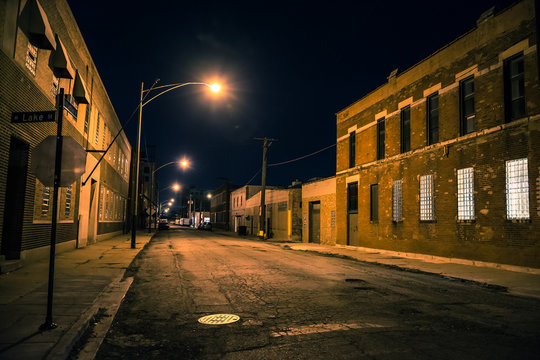 Dark and scary urban industrial city district at night