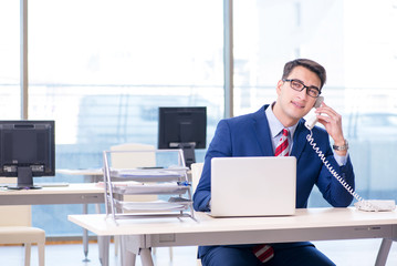 Businessman talking on the phone in the office