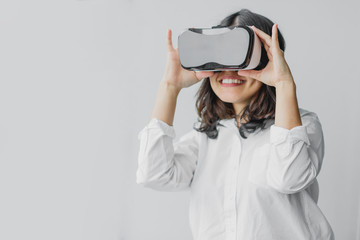 woman having fun while wearing VR headset