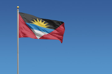 Antigua and Barbuda flag on a clear blue sky day