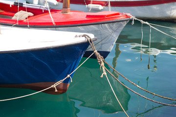 Fototapeta na wymiar Boats tied at dock with turquoise sea