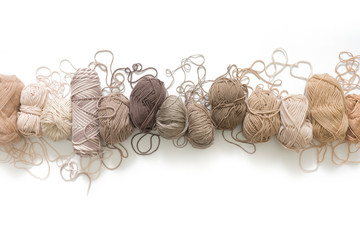 Wool and cotton yarn for knitting of neutral natural color. Background white.