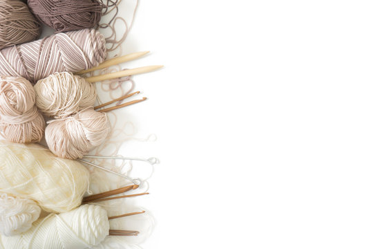 Wool and cotton yarn for knitting of neutral natural color. Background white.