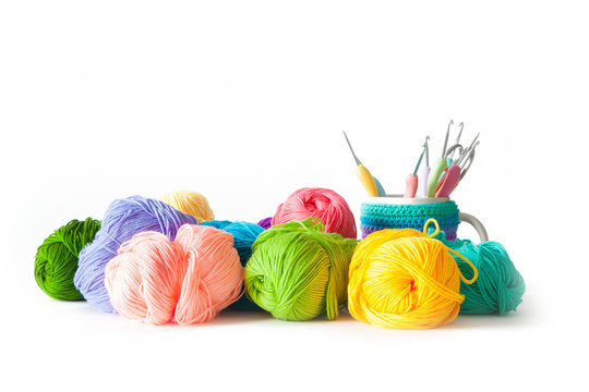 Yarn balls for knitting and hooks, knitting needles.
