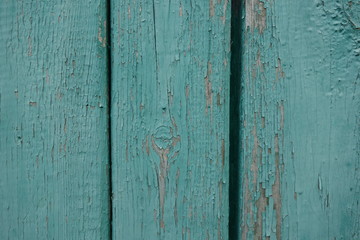 Fototapeta na wymiar Old plank wooden wall background. The texture of old wood. Weathered piece of wood.