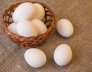 Fresh farm eggs on a rustic background