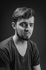 Young man scared and fearful, trying to defend himself