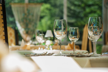 Empty glasses in the restaurant with Bokeh in the background.