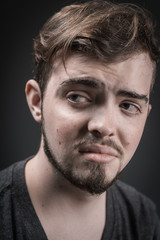 Young man scared and fearful, trying to defend himself