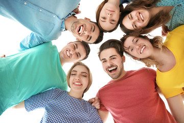 Young people joined in circle on white background. Unity concept