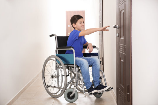 Boy in wheelchair at school corridor