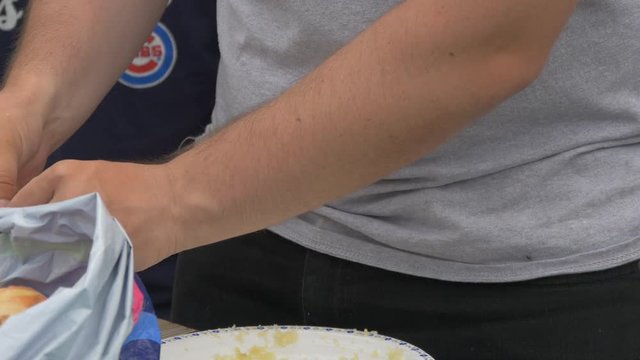 Hands peeling garlic