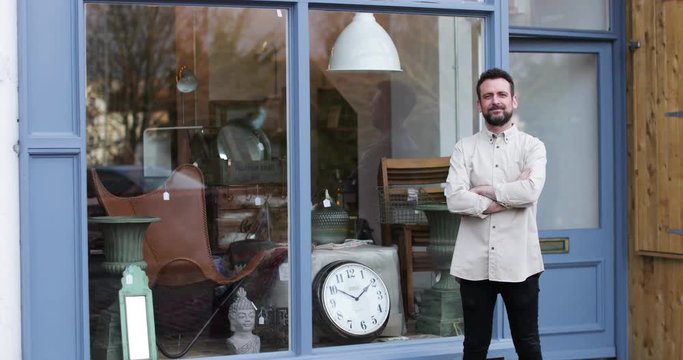 Portrait of small business owner outside store
