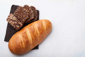 Fresh bread on stone table. Top view with space for your text