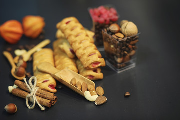 Set for breakfast. Sweets and pastries with nuts for tea on a bl