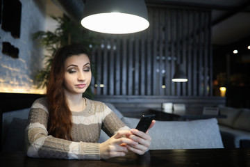 Fototapeta na wymiar Beautiful girl in a cafe 