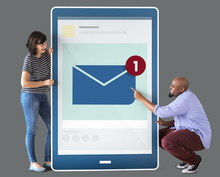 Diverse couple holding a tablet with graphics