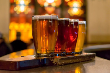 Flight of beer on the bar counter ready to be served