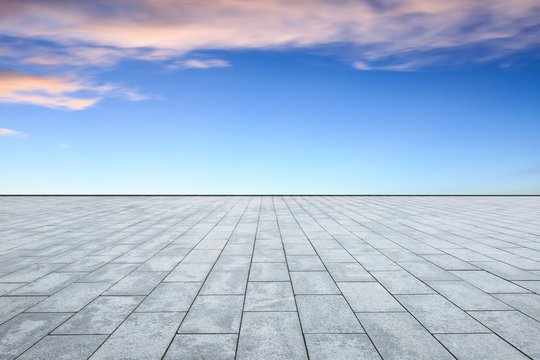 empty square floor and sky clouds at sunset