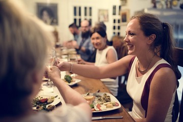 Group of diverse friends are having a dinner together