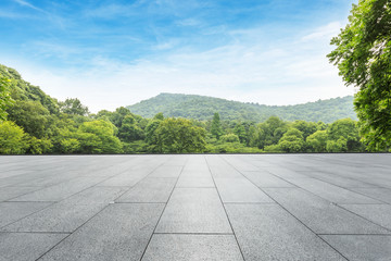 clean square floor and green mountain nature landscape