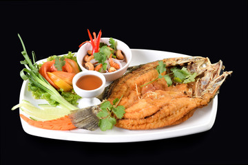 Fried fish with fresh herbs and sweet spicy sauce