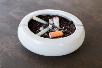 Burnt cigarette butts and ashes.