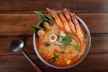 Tom Yum Goong Spicy Sour Soup in pot  top view, Thai local food