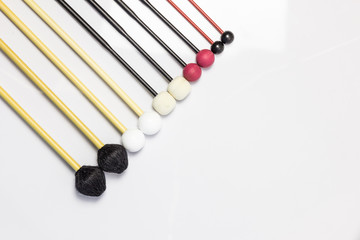 A set of mallets on white background