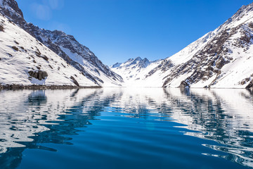 ski in chile on a sunny day with lots of snow.