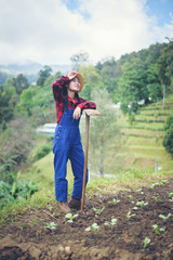 farmer woman .Planting trees in the garden