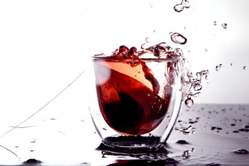 glass of water / Iced tea is a form of cold tea with sugar or a sweetener added in it.