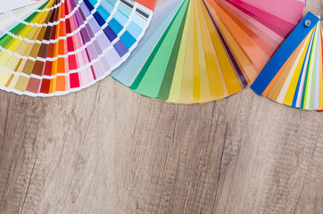 Colored specimens lie on a wooden table