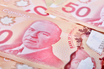 Close up of fifty Canadian banknotes (CAD) background
