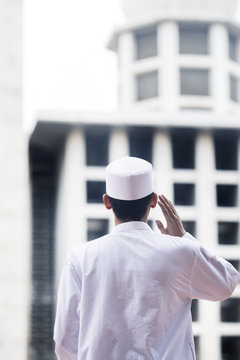 Muslim man doing azan in the mosque