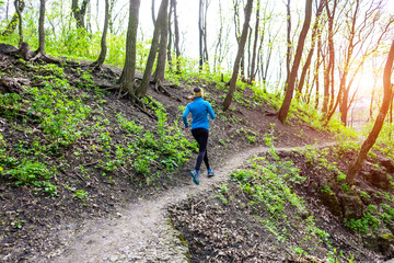 Obraz premium Girl running in the woods..