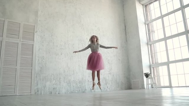 young ballet dancer dances classical ballet. A ballerina in a classic tutu and pointe dance on tiptoe. slow motion