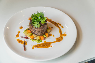 Grilled steak, French fries and vegetables