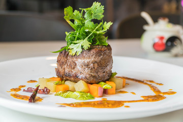 Grilled steak, French fries and vegetables